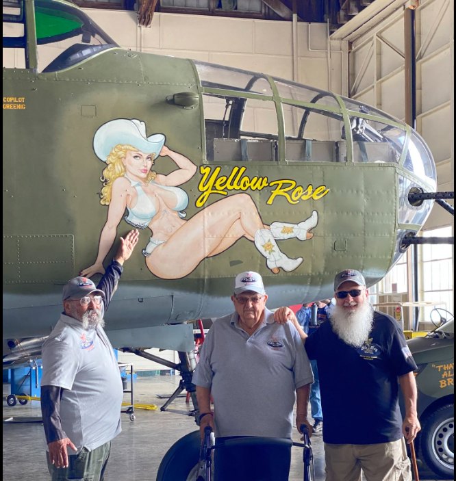 Members with the B-25 bomber Yellow Rose at the Commemorative Air Force