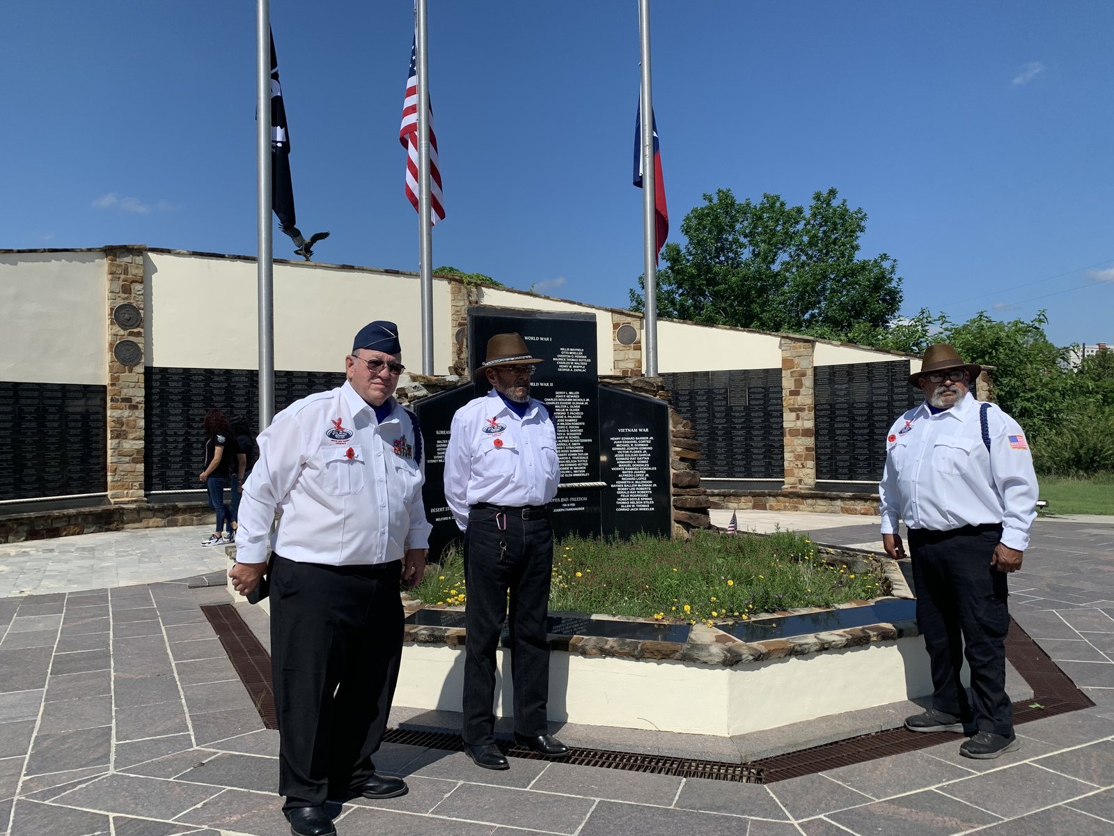 Members at a veterans memorial